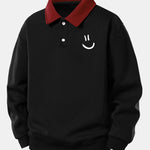 Velira Sweatshirts Juoda / XS Atsipalaidavusio kirpimo šypsenėlės printo kontrastingas polo džemperis
