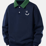 Velira Sweatshirts Jūros mėlyna / XS Atsipalaidavusio kirpimo šypsenėlės printo kontrastingas polo džemperis